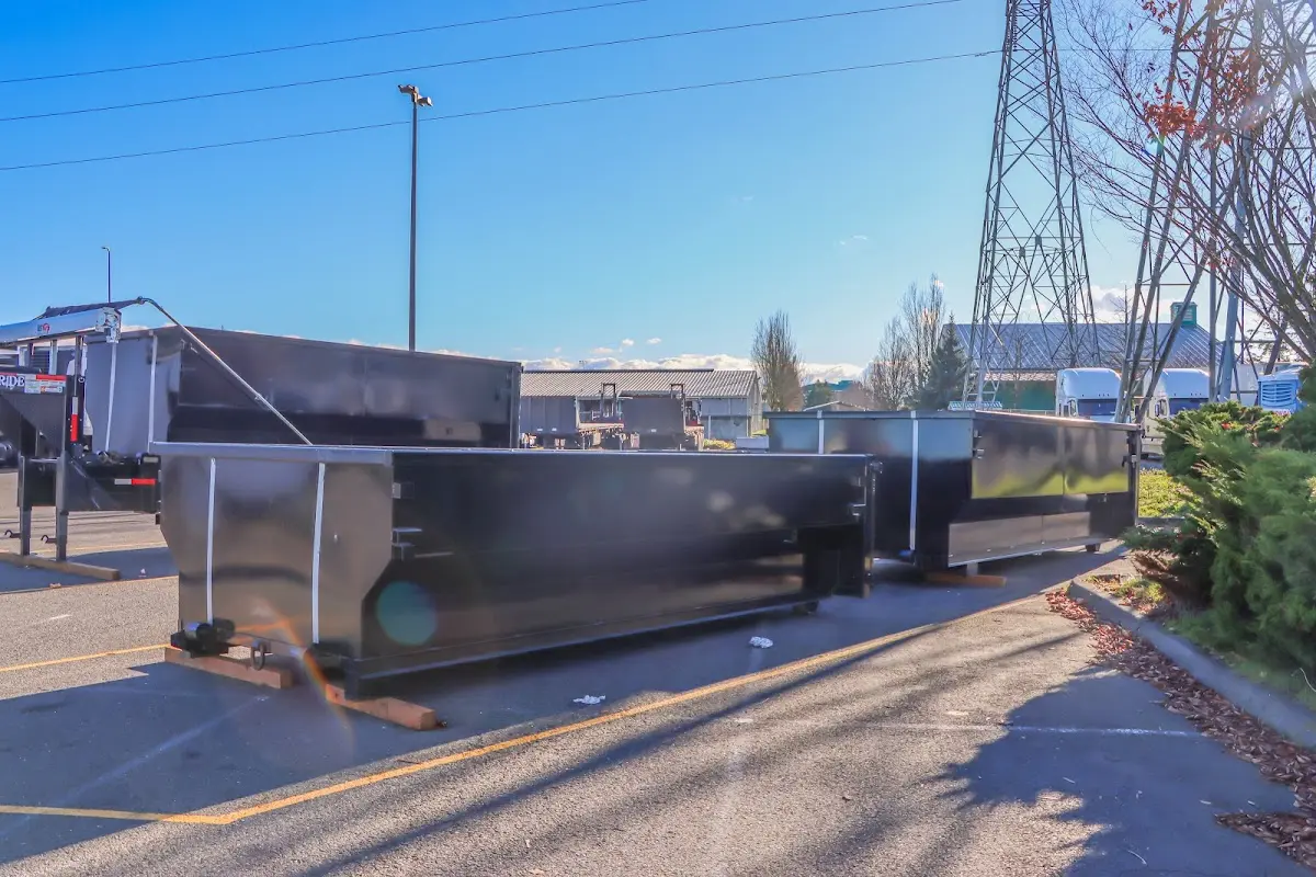 Roll-off dumpster ready for waste disposal at job site for 2 Yard Dumpster Rental in Kissimmee